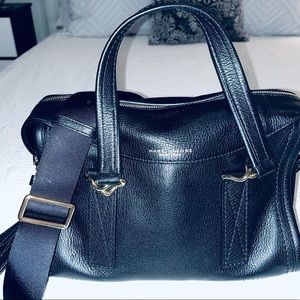Marc Jacobs black leather shoulder bag with gold accents.